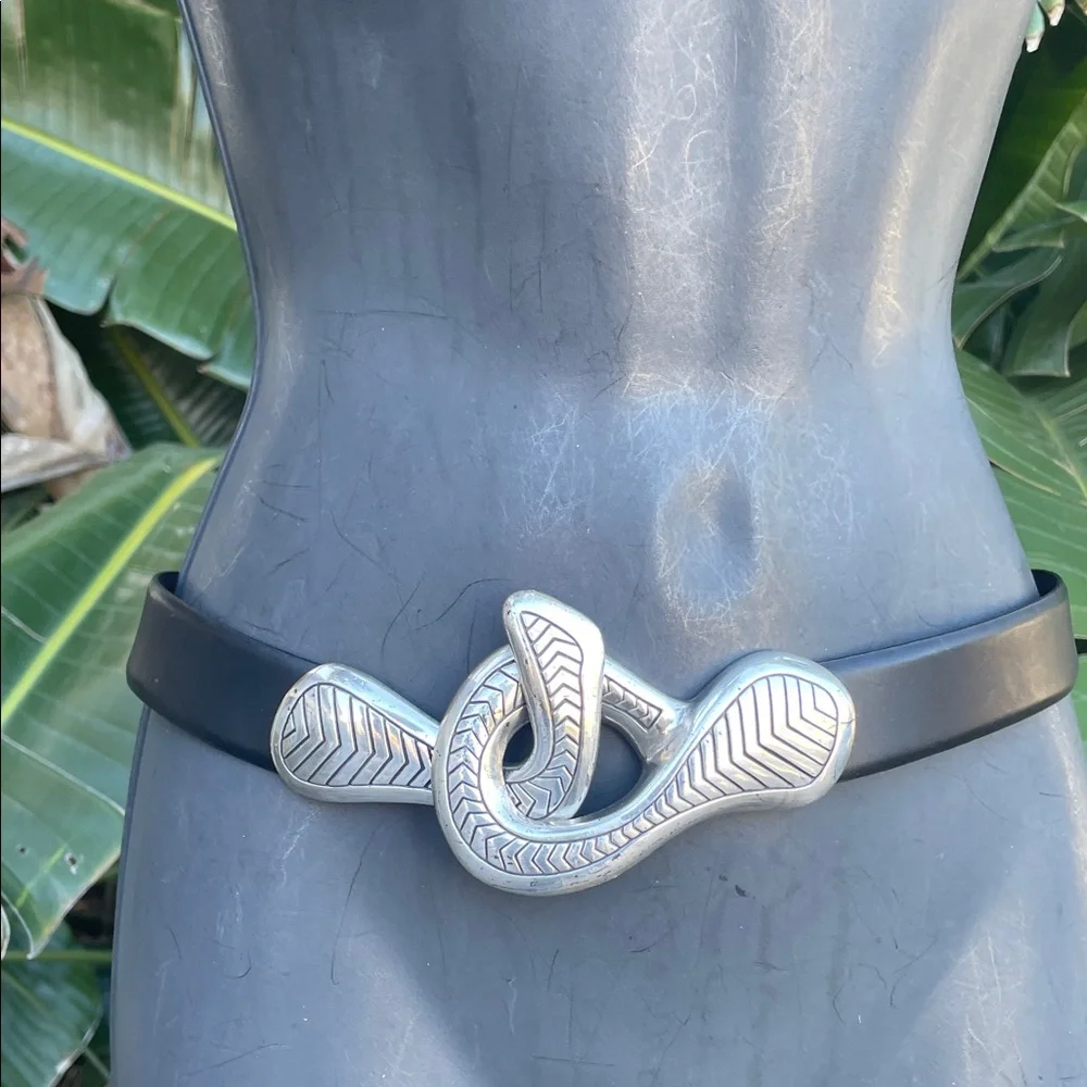 Black leather statement belt with unique silver clasp